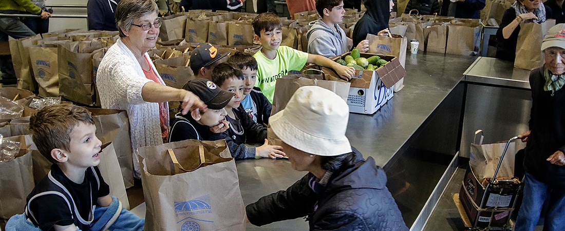 Volunteers serving food at the WBT food pantry.