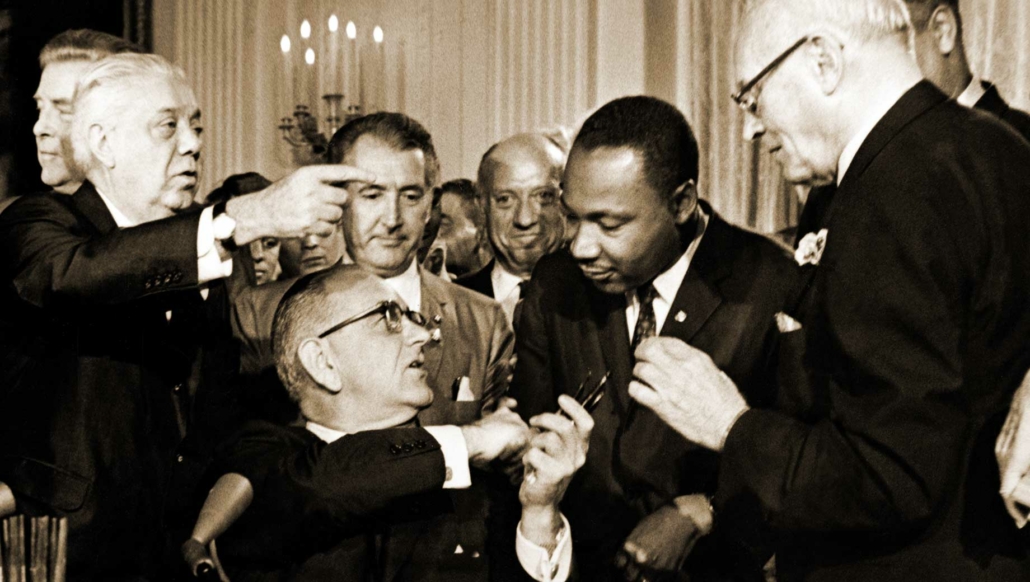 President Johnson signing the civil rights act 1964 with MLK, Jr.