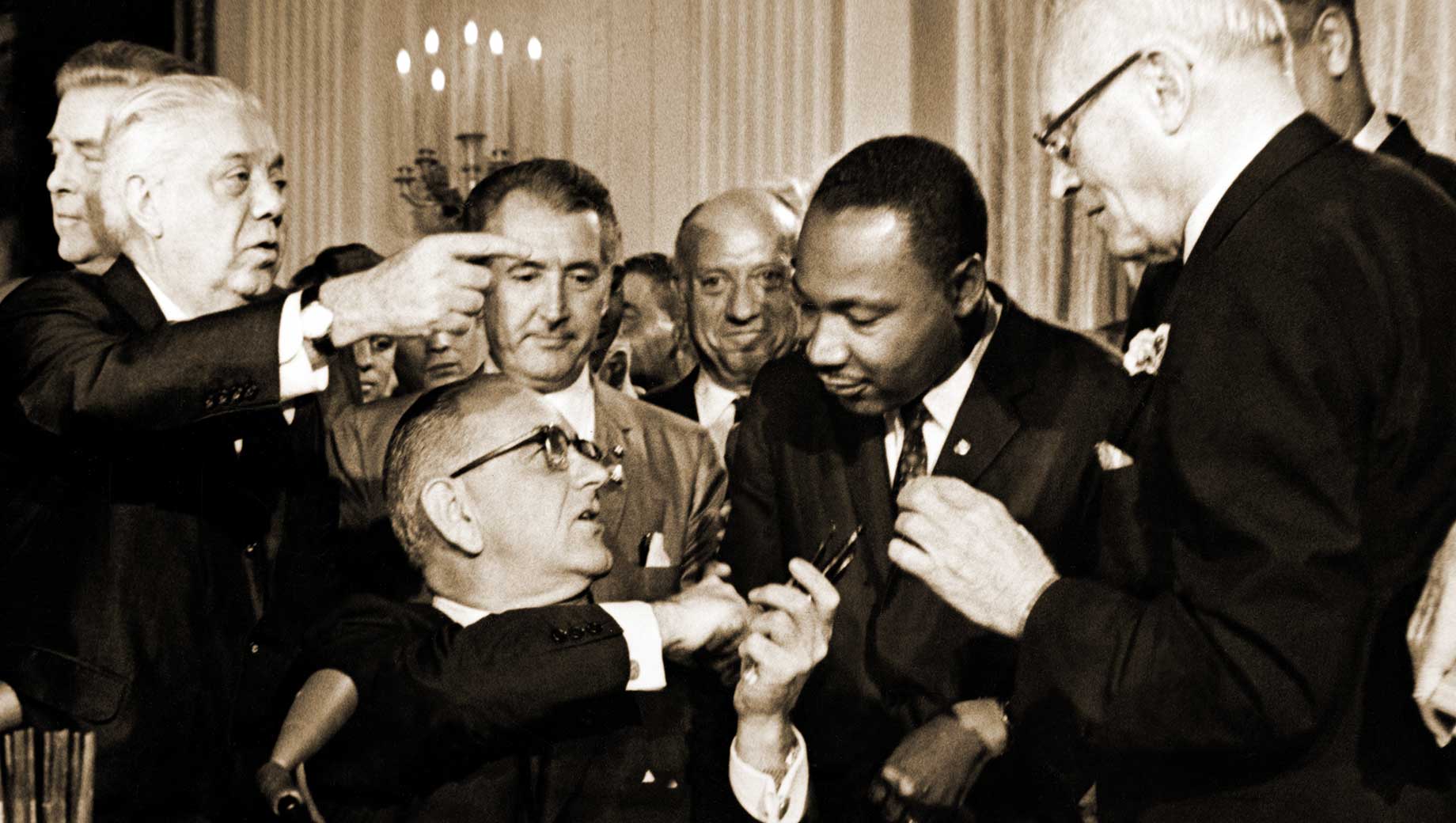 President Johnson signing the civil rights act 1964 with MLK, Jr.